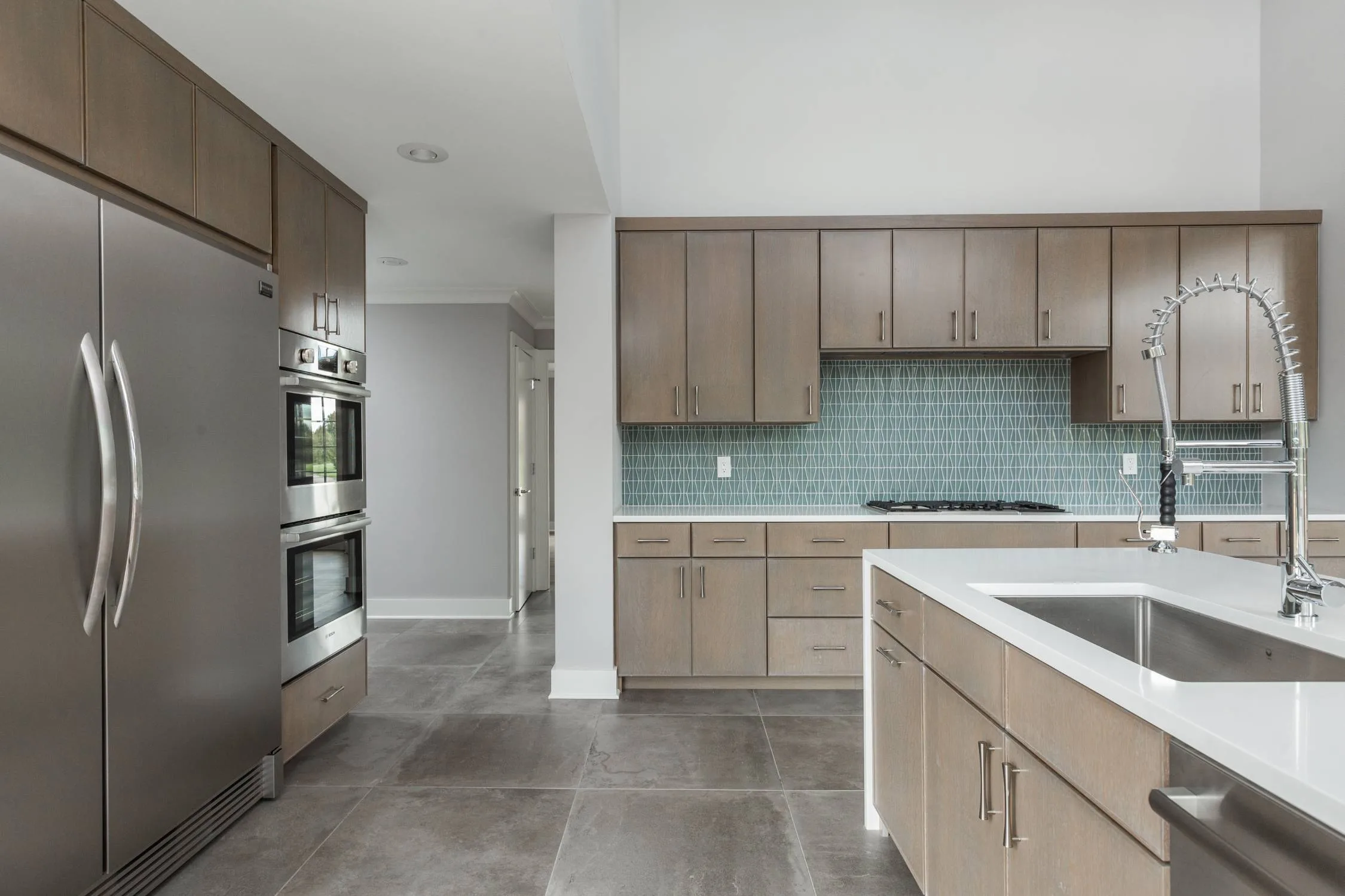 Spacious custom kitchen with stainless steel appliances and modern cabinetry by Eaton Custom Homes in Indianapolis